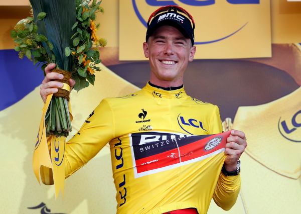 BMC Racing rider Rohan Dennis of Australia wears the race leader's yellow jersey on the podium after the 13.8 km (8.57 miles) individual time-trial first stage of the 102nd Tour de France cycling race in Utrecht, Netherlands, July 4, 2015. REUTERS/Eric Gaillard